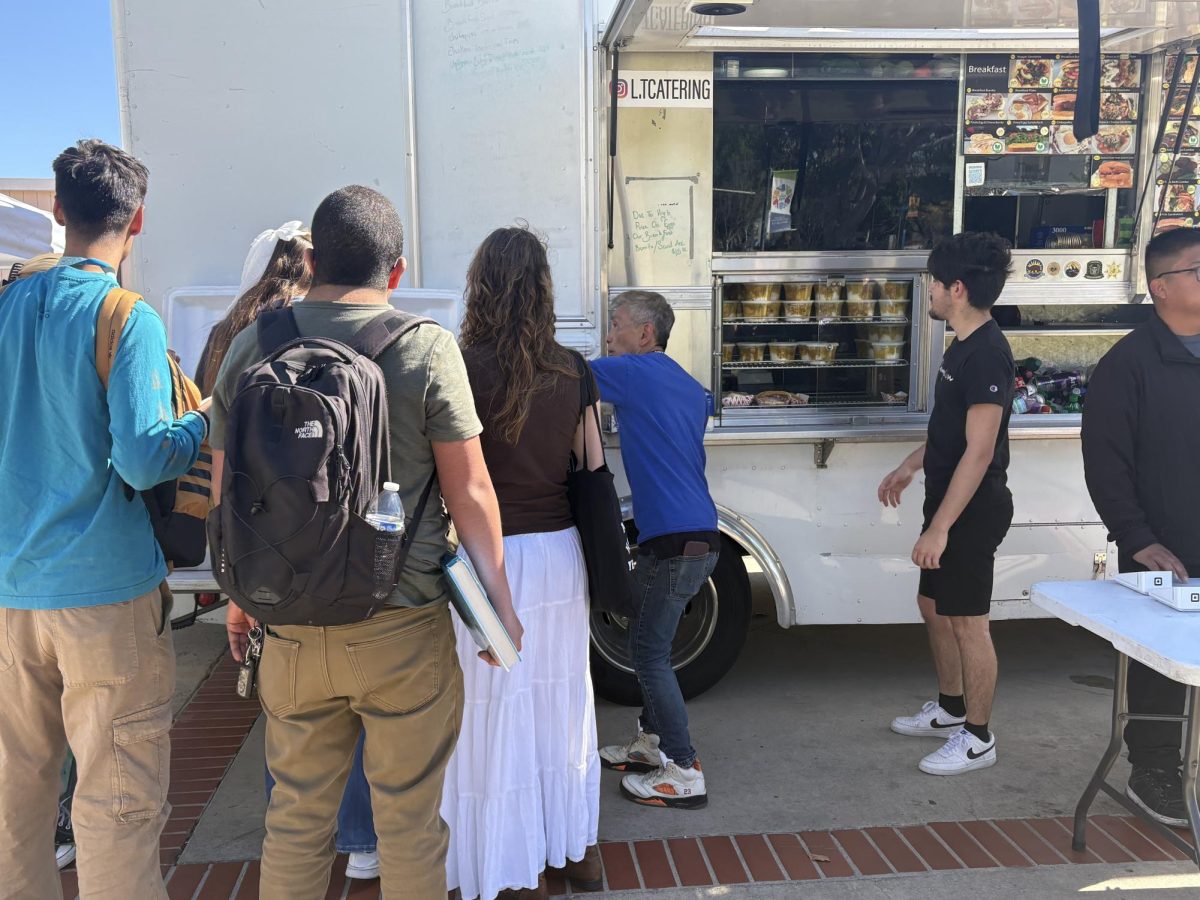 Students gathered around the L.T Catering Food Truck on campus to receive complimentary Trinidadian curry given out along the pathway of the quad as part of the LA Success Steel event on Tuesday, Feb. 25, 2025 in Moorpark, Calif. Photo credit: Danielle De Leon